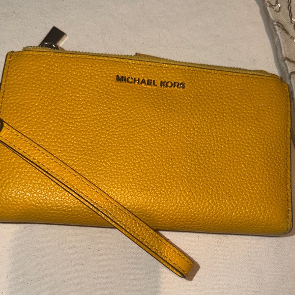 Michael Kors Handbags - Michael Kors Mustard Leather Wristlet